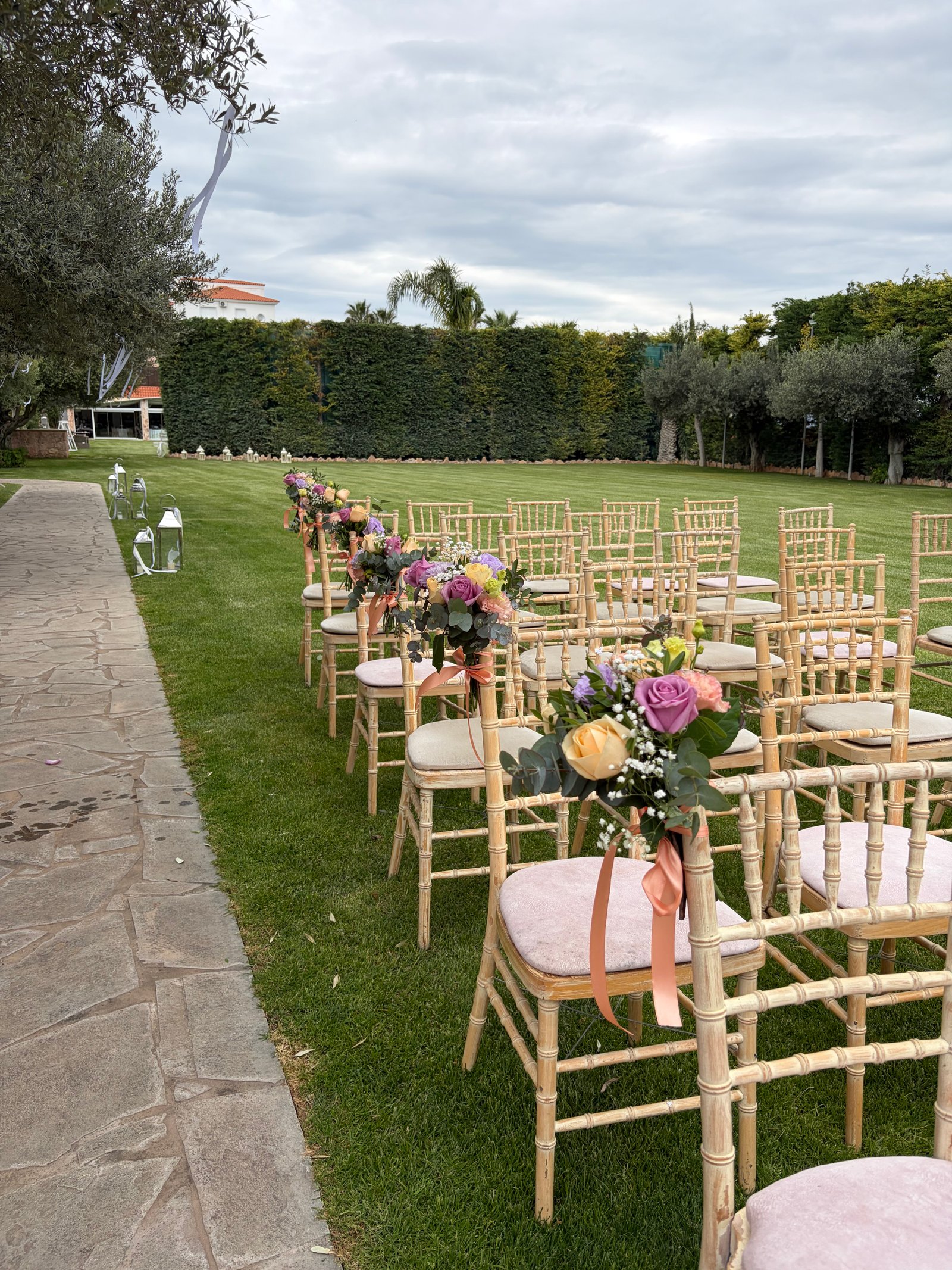 Church styling with purple and pink flowers and candles